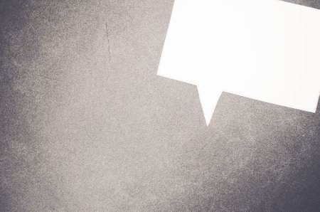 A marking pen and speech paper memo on a rough-textured surface - copy space