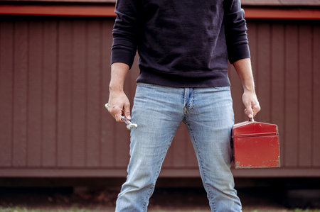 A closeup shot of a technician holding a toolbox