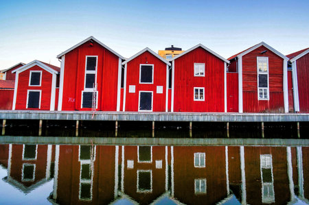 A beautiful shot of red buildings near the waterの写真素材