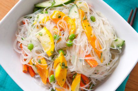 cool, healthy and refreshing mango and noodle summer saladの写真素材