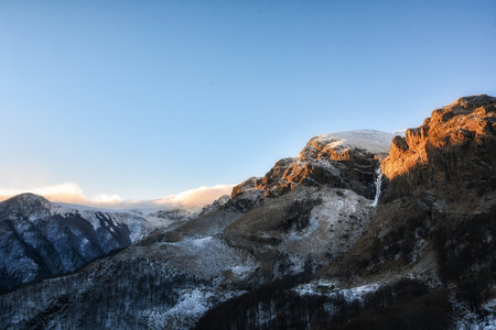 A beautiful shot of mountains under a clear blue sky