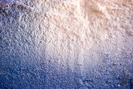 A closeup shot of a painted textured wall with air bubblesの写真素材