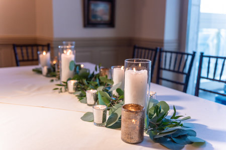 A beautiful elegant wedding table set up decorated with flower compositions and candles