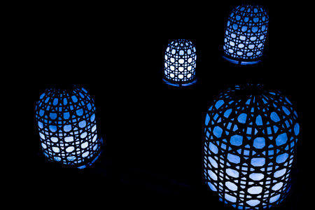 A closeup of blue lamps in a dark room - cool for backgrounds and wallpapersの写真素材
