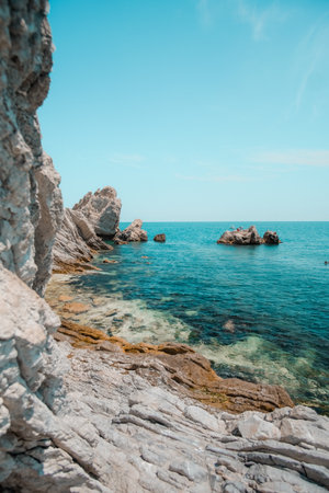 A beautiful shot of a tropical island surrounded by clear water on a sunny day