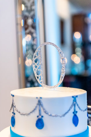A vertical  selective focus closeup of the wedding cake