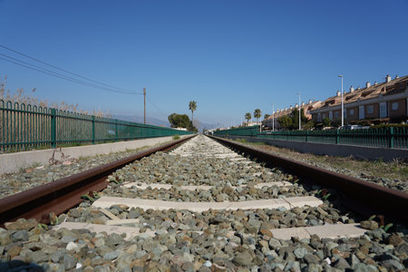 The rusted rails in the railway station during daytimeの写真素材