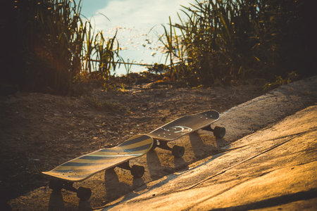 A vintage-style shot of the old skateboard in the streetの写真素材