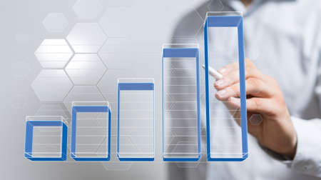 A closeup shot of a businessman presenting the virtual projection of a diagramの写真素材