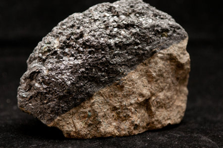 magnetite metal mineral sample with granite and quartzの写真素材