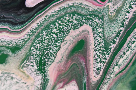 Abstract patterns in the water with colorful mixed paints