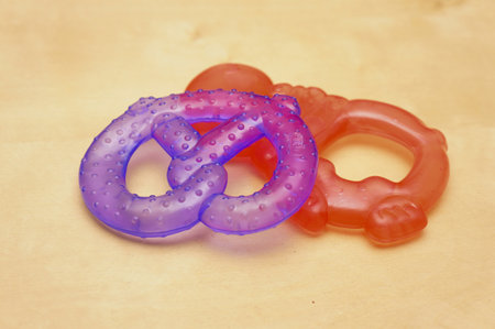 A closeup shot of soft chew baby toys on different shapes