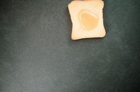A high angle shot of a toast bread on a gray surface - perfect for your content