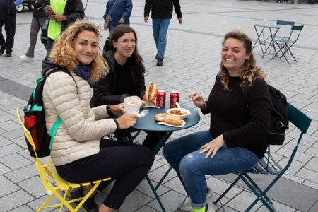 CHRISTCHURCH, NEW ZEALAND - Feb 14, 2020: The public enjoying their food from the Friday Food Carts in Christchurch, New Zealand.のeditorial素材