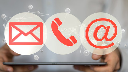 A closeup shot of a person presenting a virtual projection of communication toolsの写真素材