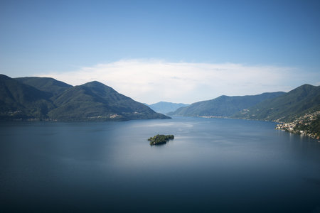 The Maggiore Alpine Lake  surrounded by Brissago Islands under the sunlight in Ticino in Switzerlandの写真素材