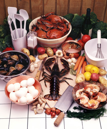 A vertical shot of a lobster in the middle of the seafoodの写真素材