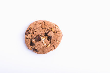 A closeup shot of a chocolate chip cookie isolated on a white background