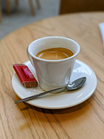 A vertical shot of espresso in a white cupの写真素材
