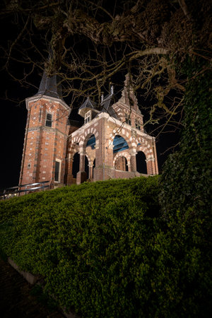 The beautiful brick building of Waterpoort Gate in the harbor of Sneek, Friesland, Netherlandsのeditorial素材