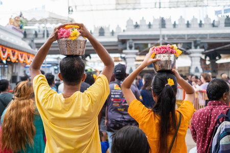 SINGAPORE, SINGAPORE - Feb 08, 2020: Thaipusam is a religious celebration by devotees. Its highlight is a barefoot walk of devotees carrying milk pots and dancing with prickly kavadis.のeditorial素材