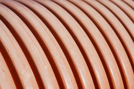 Row of curve lines orange plastic background.の写真素材