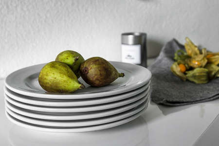 Figs on plate with physalis in background