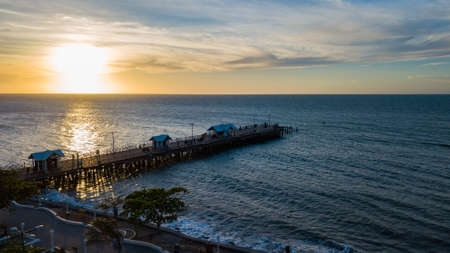 A beautiful view of a beach resort with a scenery of sunset in the backgroundの写真素材