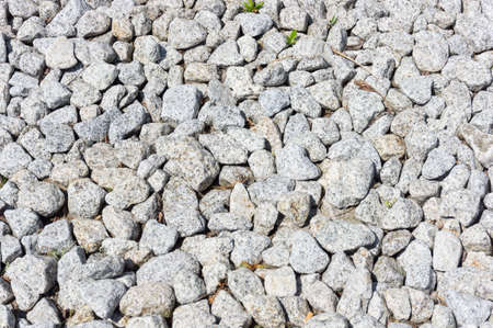 A closeup shot of the ground full of pebble stones - perfect for background