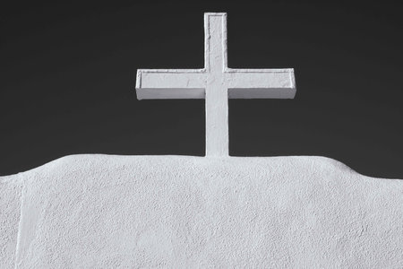 A grayscale shot of a cross on top of the roof in Northern New Mexico.の写真素材