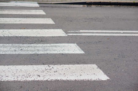 A white crossing lines with a blurred background
