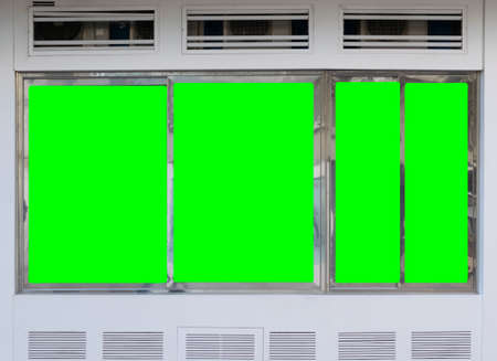 Green screen billboard or large display on nice old historical building in european mediterranean city center. Entertainment and consumerism conceptの写真素材