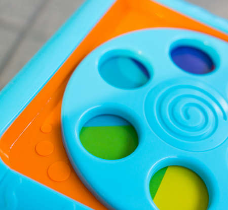 A closeup shot of a blue circular toy for children
