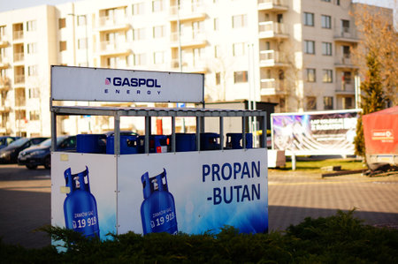 POZNAN, POLAND - Feb 08, 2020: Blue Gaspol gas bottles on metal rack.のeditorial素材
