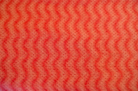 A close-up of a new bright dishcloth
