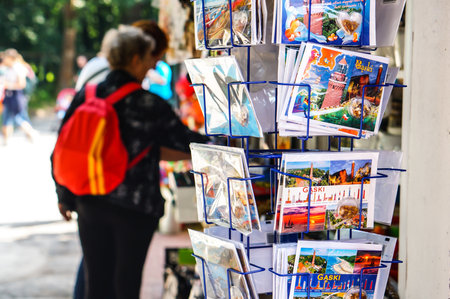 GASKI, POLAND - Jul 28, 2016: Variation of postcards for sale by a souvenir shop.のeditorial素材