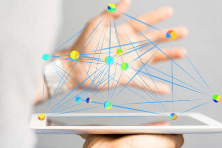 A male hand and dots connected to each other- global connectivity data and digital networkの写真素材