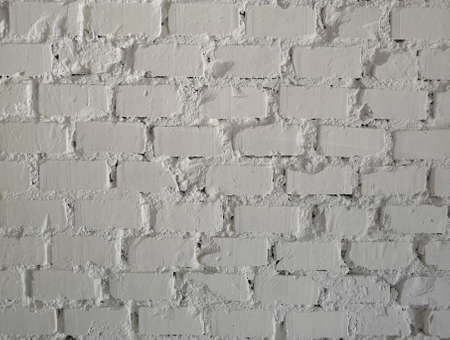 A background of a white wall with bricks
