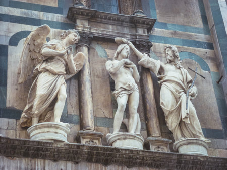 A religious statue on the side of a building in Florence, Italyのeditorial素材