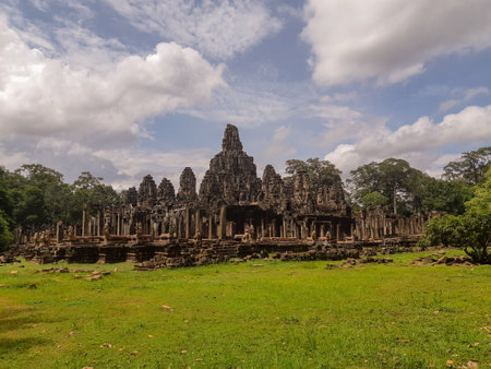 A panoramic shot of an old Khmer temple surrounded by trees at Angkor Wat, Siem Reap, Cambodiaのeditorial素材