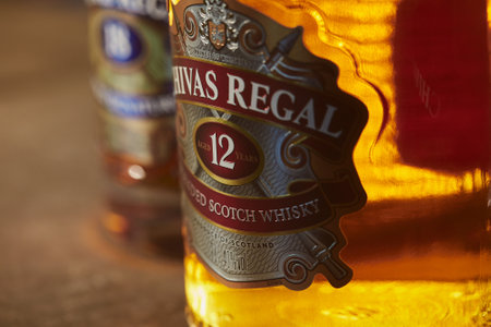 SAO PAULO, BRAZIL - Jan 01, 2020: Close-up in a bottle of Chivas Regal 12yo, with Chivas 18yo at the blurred background.のeditorial素材