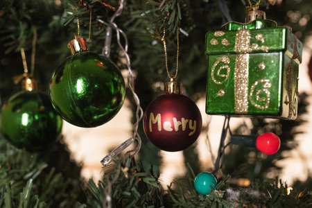 A closeup shot of beautiful hanging ornaments on a Christmas tree