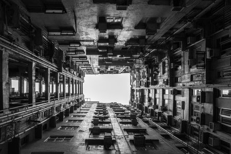 A greyscale shot of residential buildings in Kowloon, Hong Kongの写真素材