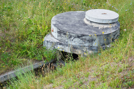 Several circular stones on top of each other surrounded by grassの写真素材