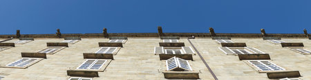 A panoramic low angle shot of the facade of a building in Santiago de Compostela, Galicia, Spainの写真素材