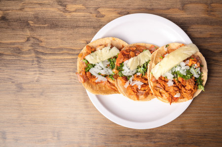A top view of delicious and appetizing Mexican food on a wooden tableの写真素材