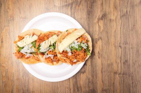 A top view of delicious and appetizing Mexican food on a wooden tableの写真素材