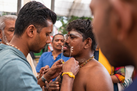 SINGAPORE, SINGAPORE - Feb 08, 2020: Thaipusam is a religious celebration by devotees. Its highlight is a barefoot walk of devotees carrying milk pots and dancing with prickly kavadis.のeditorial素材