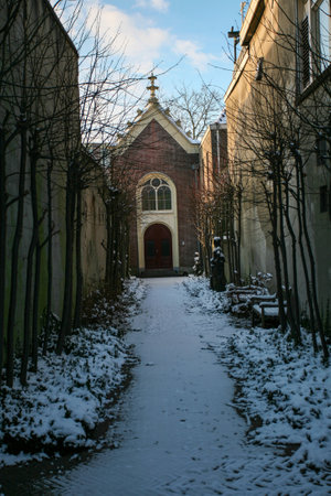 A vertical shot of a narrow pathway towards a churchのeditorial素材
