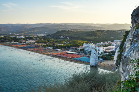 A panoramic view of Vieste beach and the famous Pizzomunno rock, Gargano, Apulia, Italyのeditorial素材